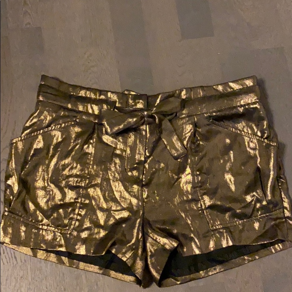 BCBG gold metallic shorts with bow